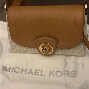 Michael Kors small clutch purse never carried